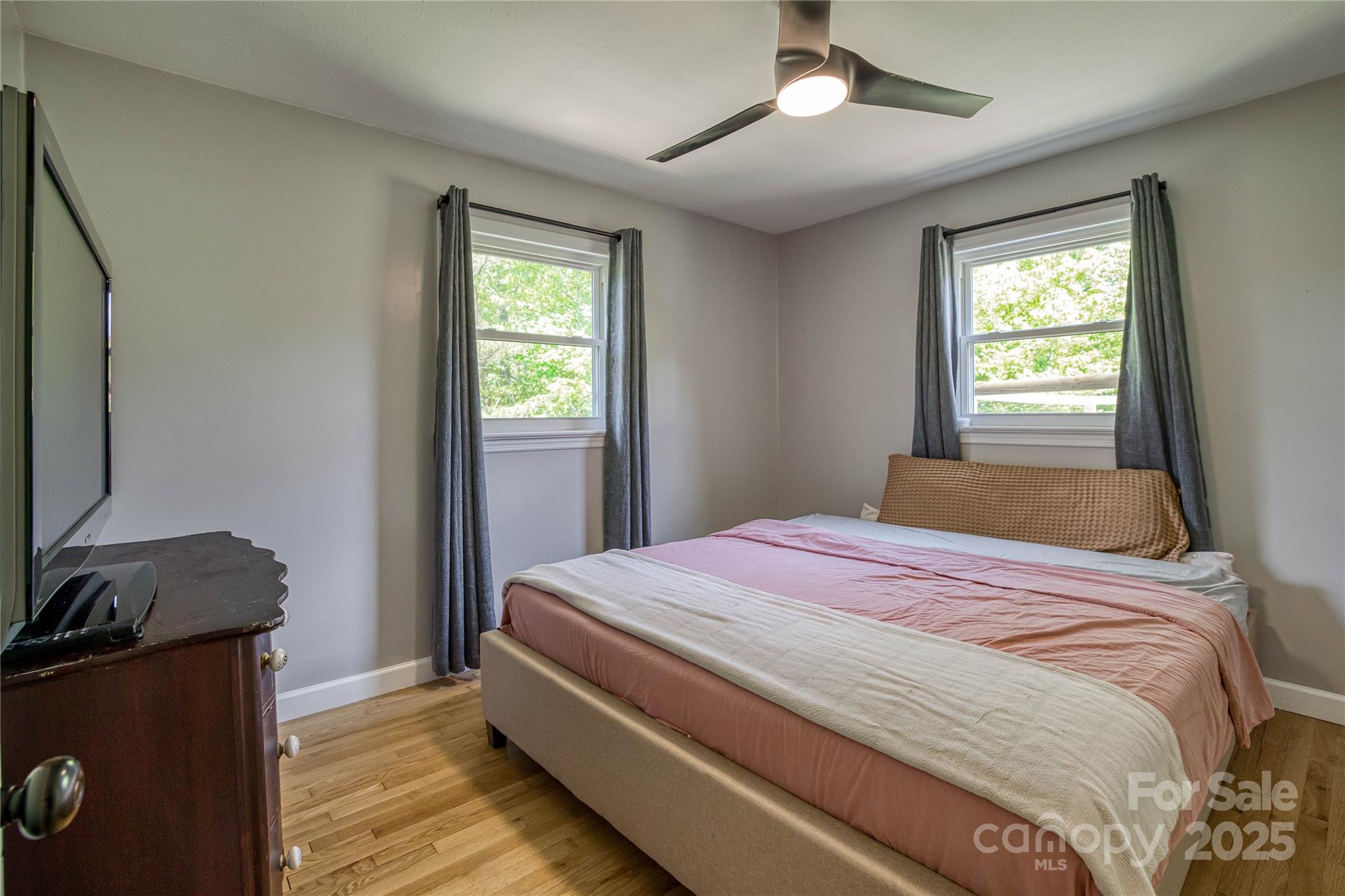 111 Baxter Street Morganton, NC 28655 - Photo 9 of 26 a bedroom with a bed and a window