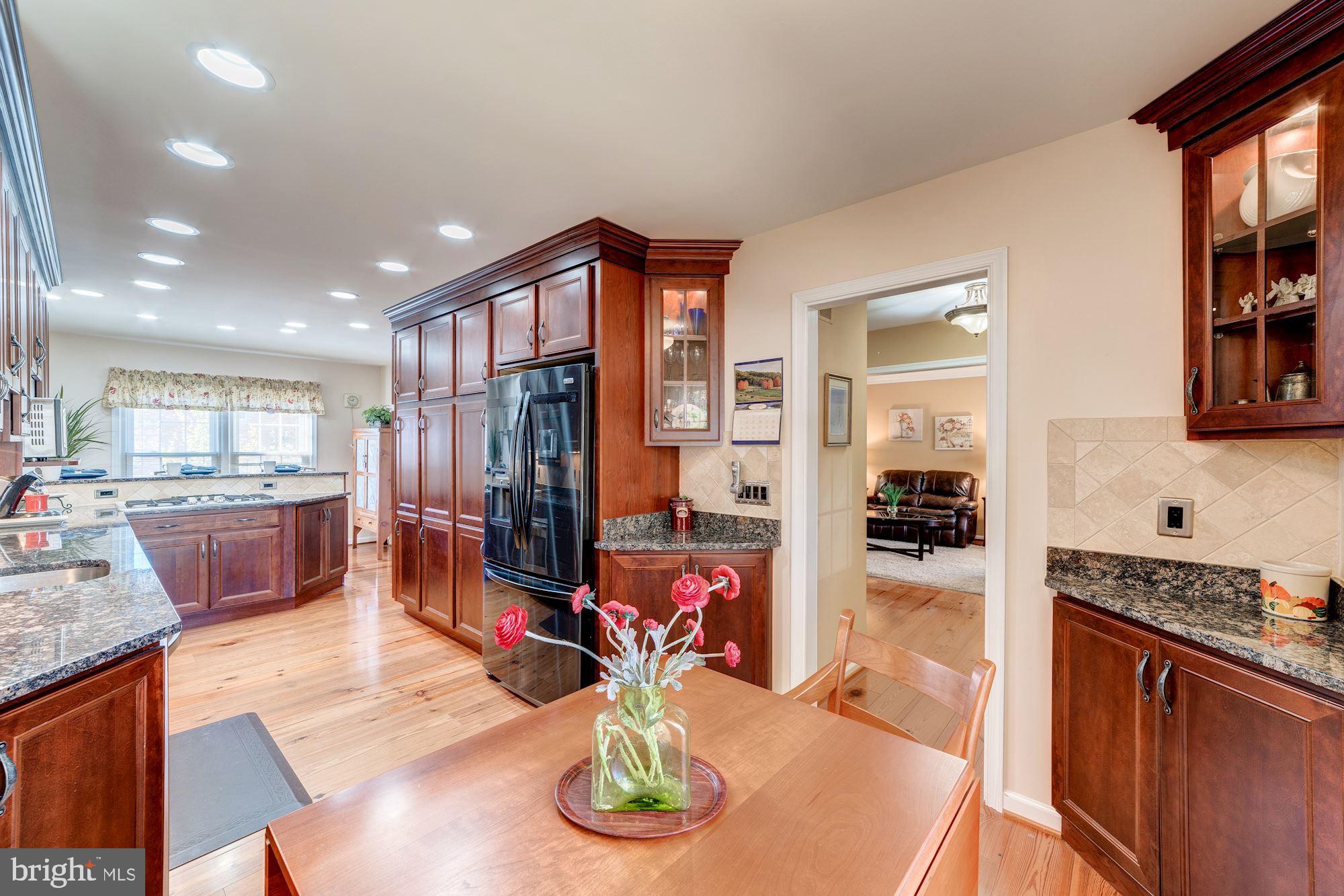 6011 Queenston Street Springfield, VA 22152 - Photo 6 of 57 Glass cabinetry with in-cabinet lighting