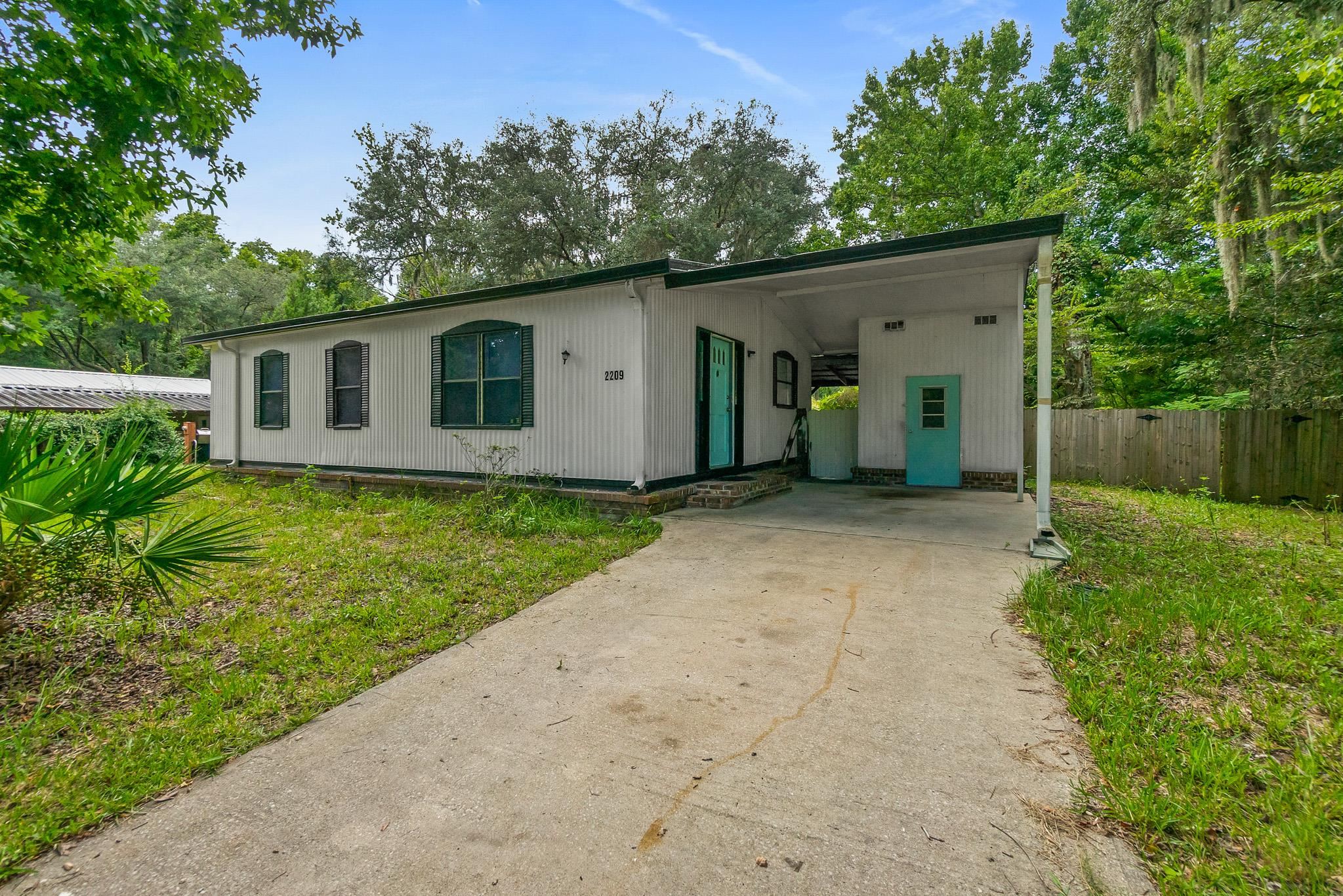 2209 Twin Fox Trail St. Augustine, FL 32086 - Photo 24 of 39 a view of a house with a yard