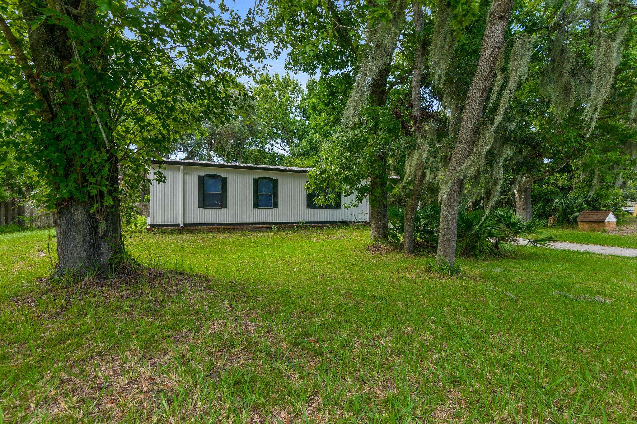 2209 Twin Fox Trail St. Augustine, FL 32086 - Photo 26 of 39 a view of a house with backyard and garden