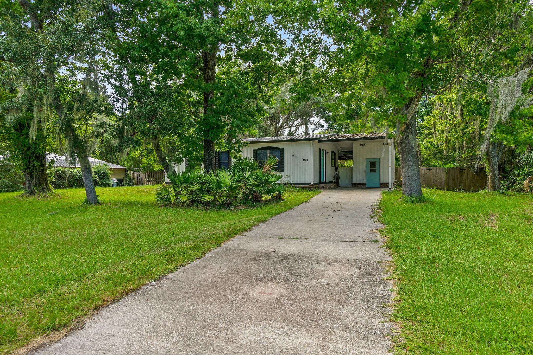2209 Twin Fox Trail St. Augustine, FL 32086 - Photo 29 of 39 a front view of house with yard and green space