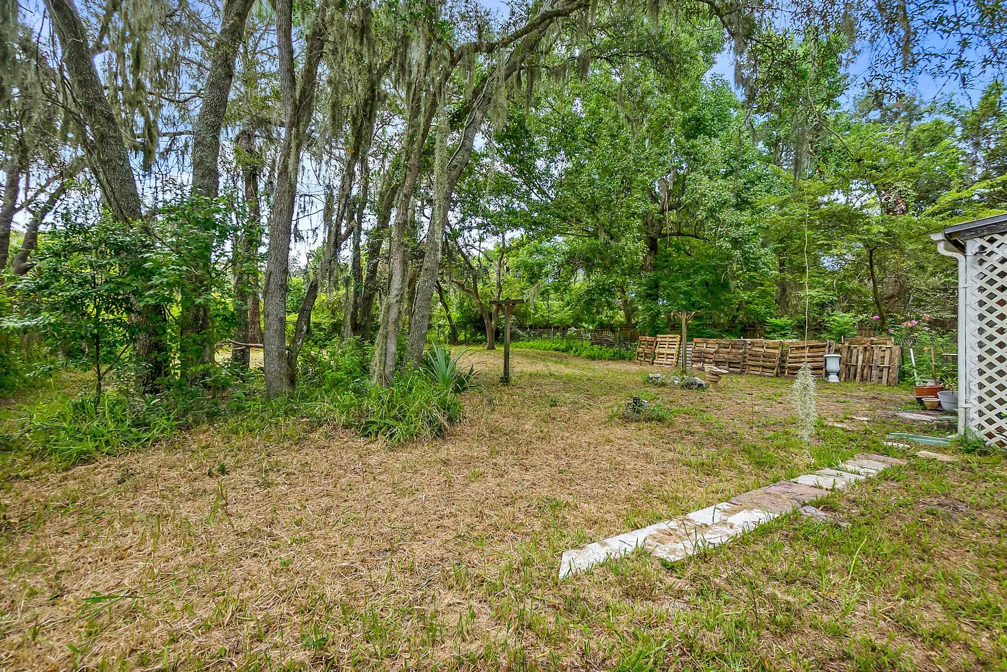 2209 Twin Fox Trail St. Augustine, FL 32086 - Photo 36 of 39 a view of a yard with a tree