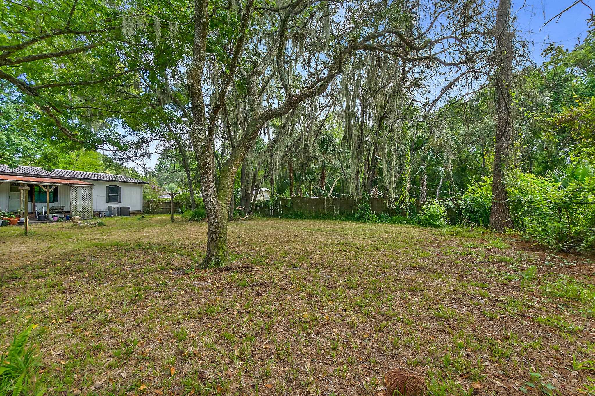 2209 Twin Fox Trail St. Augustine, FL 32086 - Photo 38 of 39 a view of a house with yard and a tree