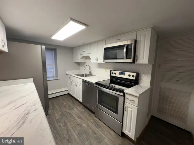 a kitchen with a stove and a microwave