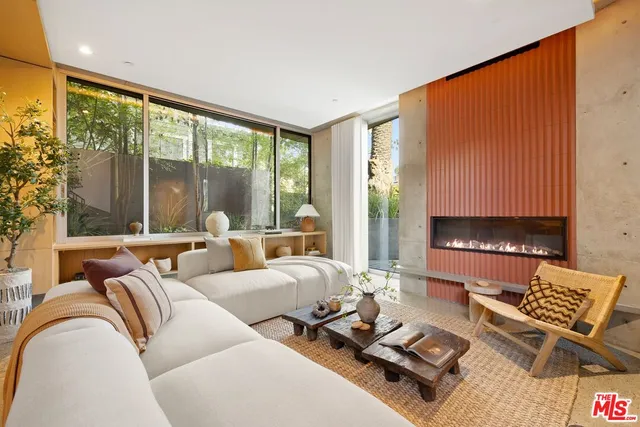 a view of a chairs and table in the balcony