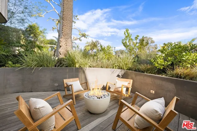 an open kitchen with a sink and a large window
