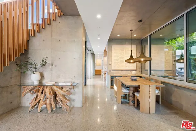 a bedroom with a bed couch and window