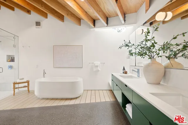 a large white tub sitting in a bathroom