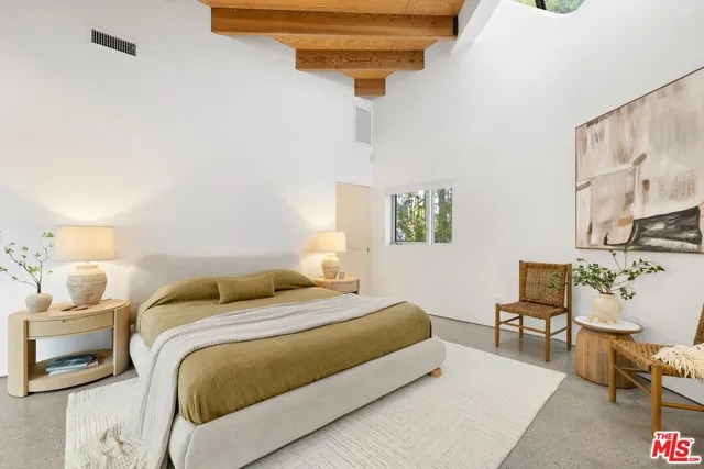 a bathroom with a bathtub sink and mirror