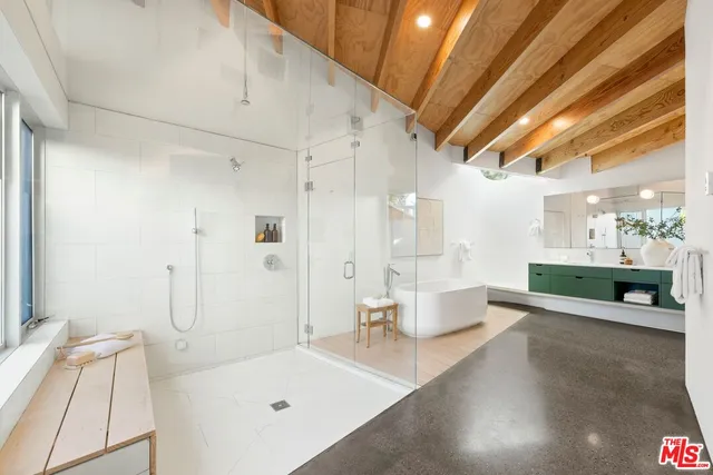 a bed room with a bed and a chair