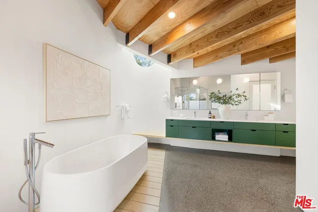 a bathroom with a sink a toilet and bathtub