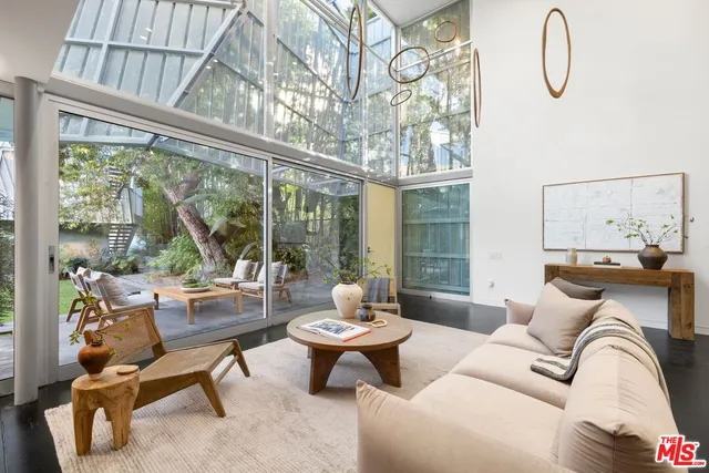 a bedroom with a bed and glass window