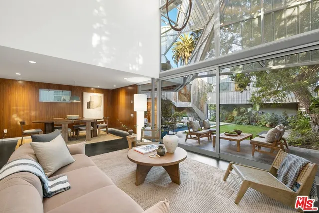 a large white tub sitting next to a white sink