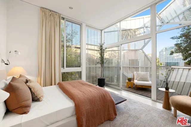 a kitchen with a sink and chairs