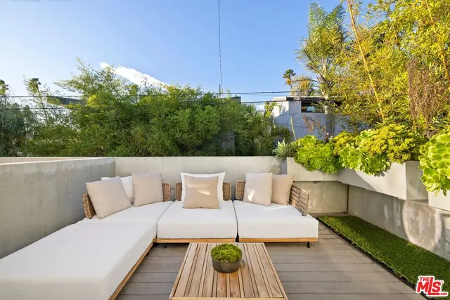 a bed room with a bed and a large mirror