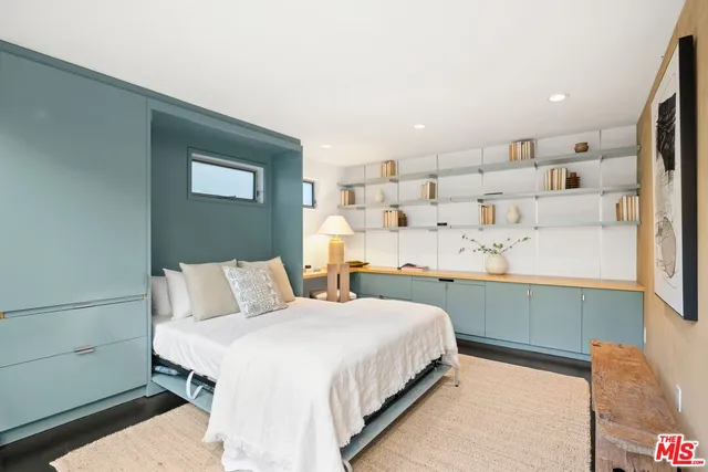 a view of a patio with couches table and chairs and potted plants