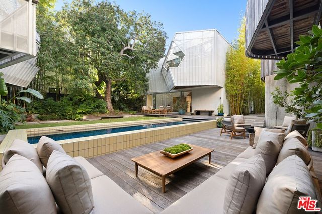 a large kitchen with a table and chairs