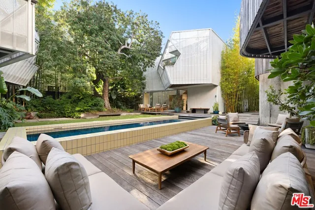 a large kitchen with a table and chairs
