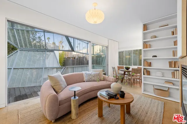 a view of a palm trees front of a house