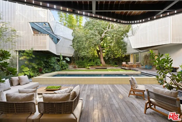 a spacious bathroom with a granite countertop sink and a large mirror