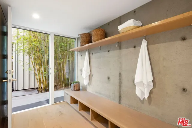 a living room with furniture and large window