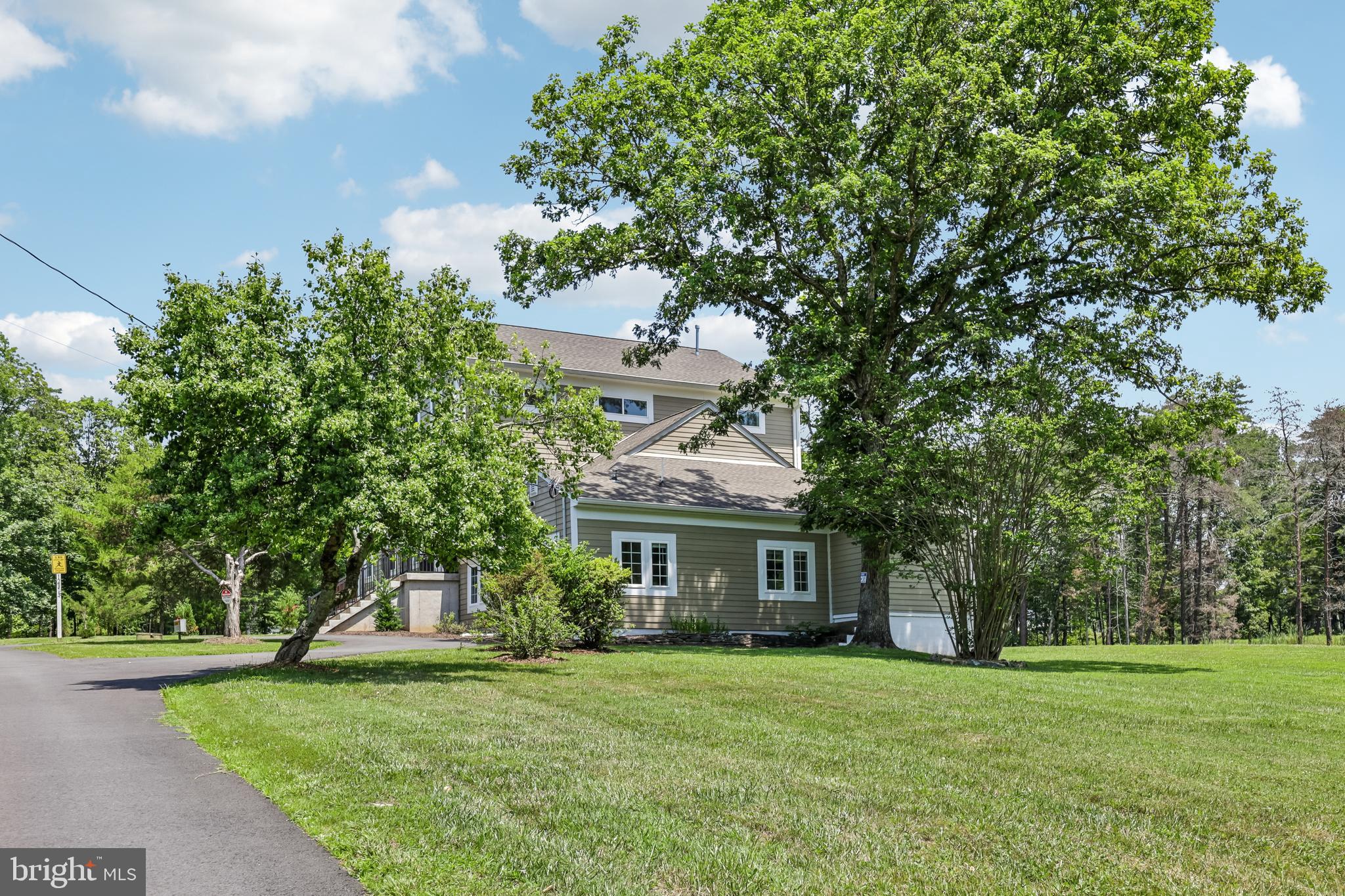 12304 Popes Head Road Fairfax, VA 22030 - Photo 77 of 78 a front view of a house with a garden