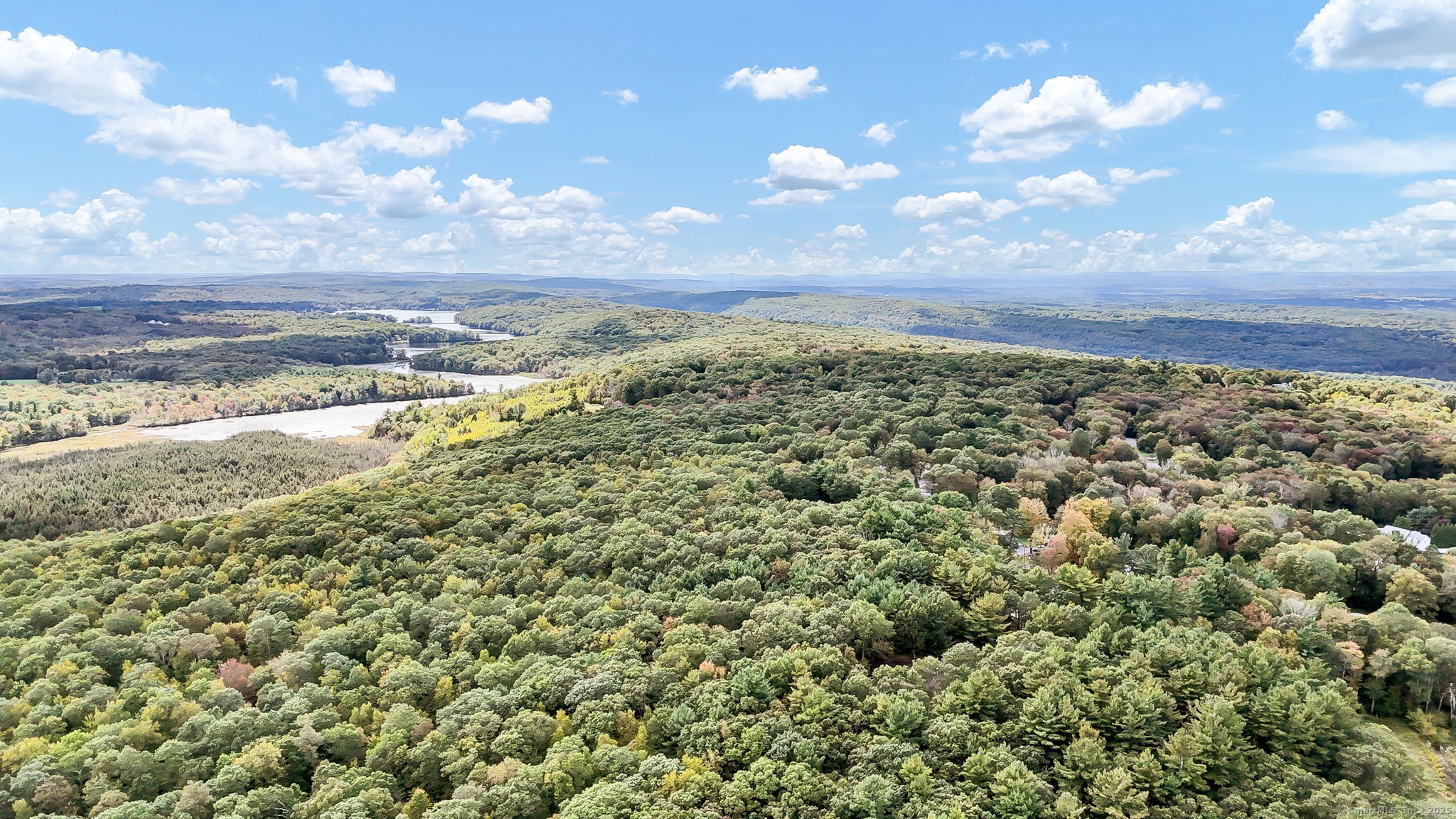 93 Dockerel Road Tolland, CT 06084 - Photo 6 of 12 a view of a large building with lots of trees