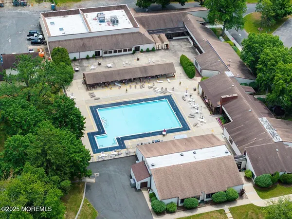an aerial view of residential house with outdoor space and street view