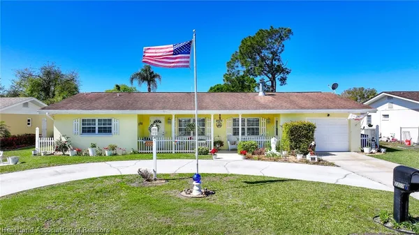 a view of a house with a yard patio and a yard