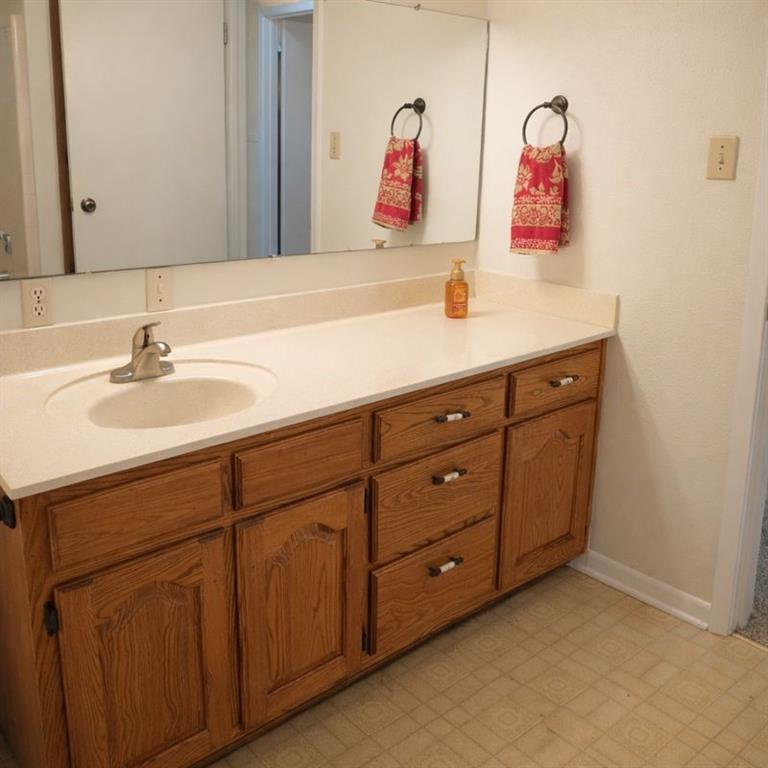 543 County Road 2940 Alba, TX 75410 - Photo 12 of 15 a bathroom with a sink and a mirror