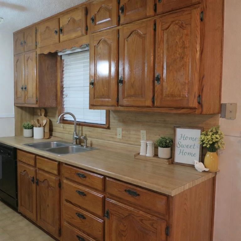 543 County Road 2940 Alba, TX 75410 - Photo 3 of 15 a kitchen with stainless steel appliances granite countertop a sink and cabinets