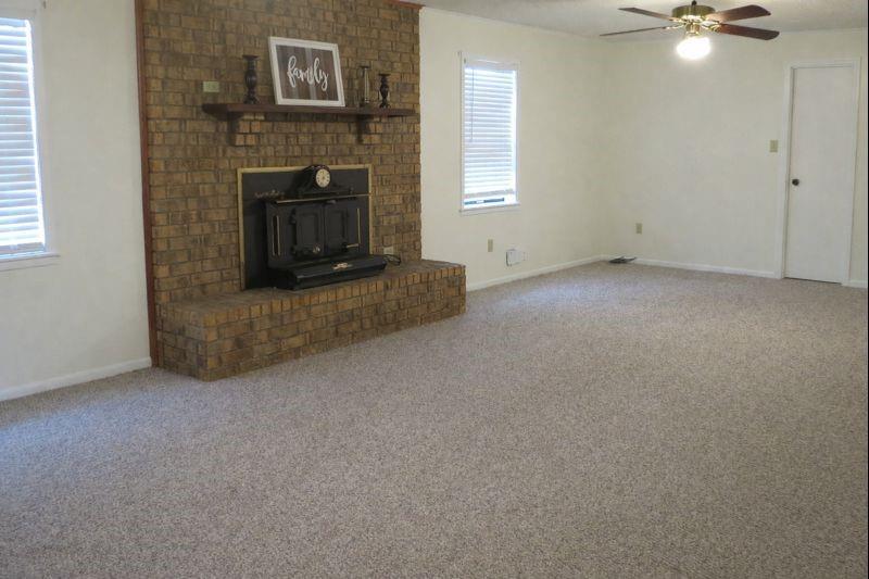 543 County Road 2940 Alba, TX 75410 - Photo 9 of 15 a view of a livingroom with a fireplace and window