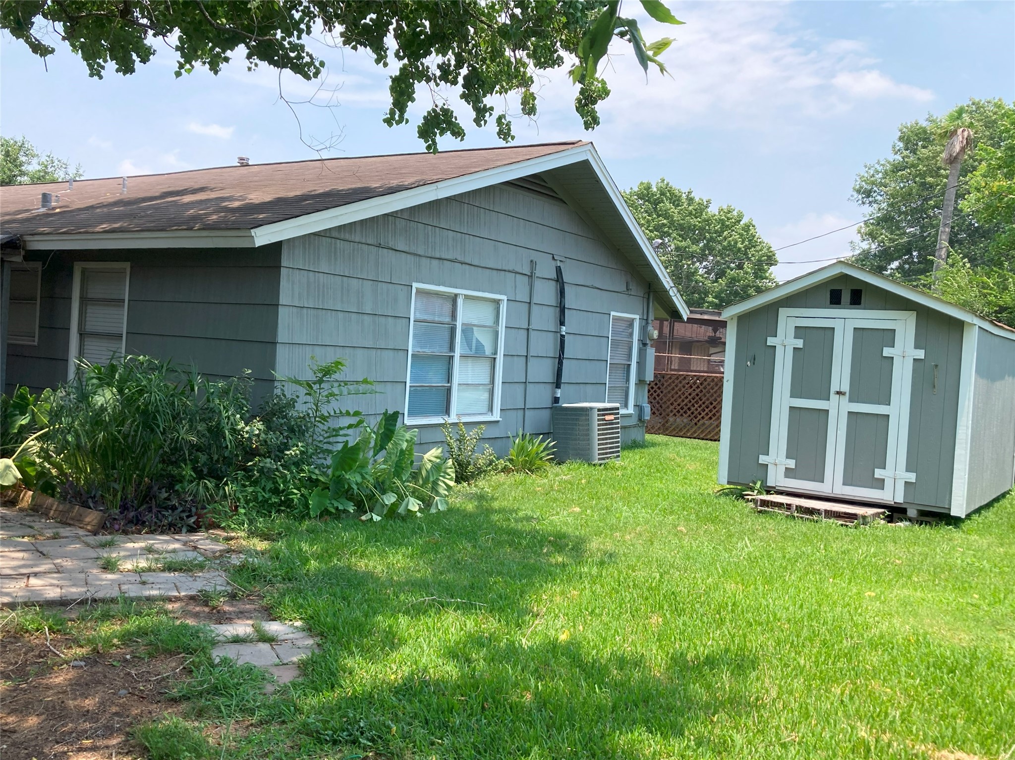 1202 Dunstan Road Pasadena, TX 77502 - Photo 5 of 24 Fenced backyard with storage shed. Home backs up to Bailey Elementary.