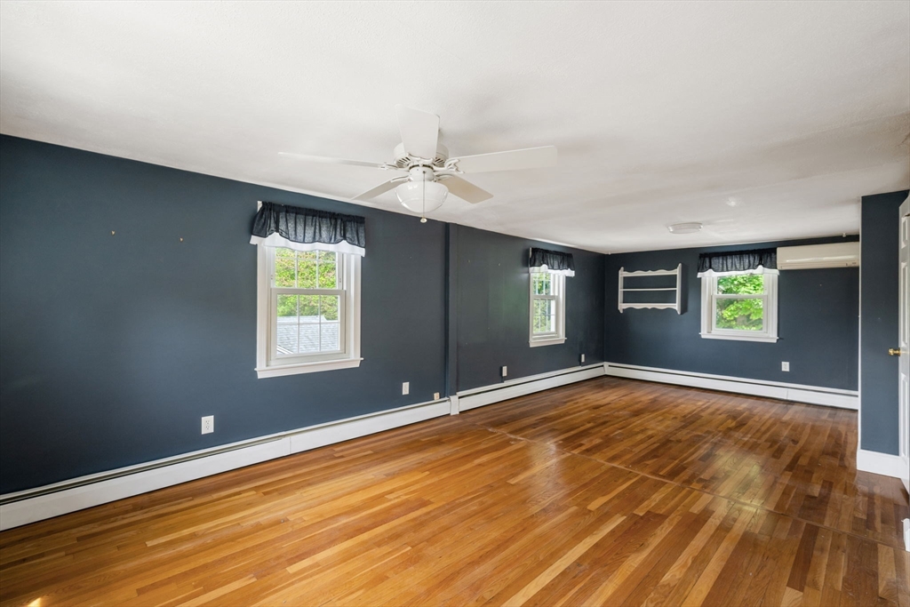 40 Bell Road Weymouth, MA 02188 - Photo 38 of 41 an empty room with window and wooden floor