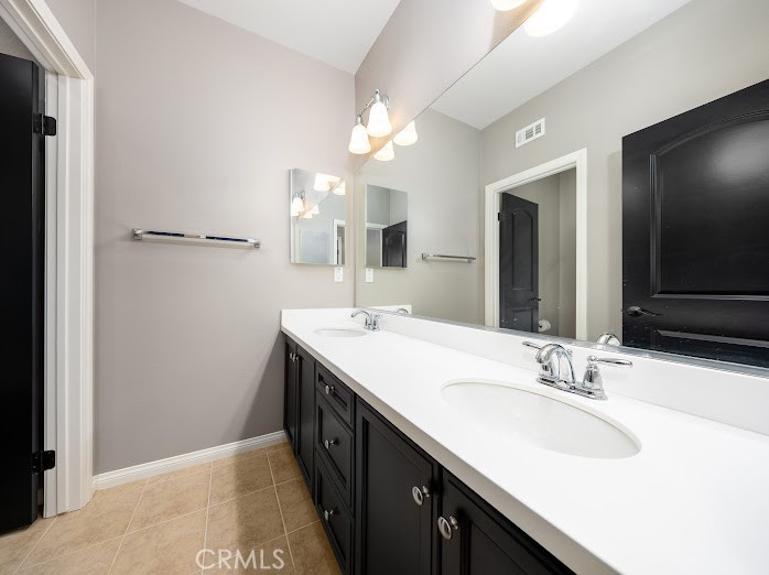 2999 Walking Beam Place Brea, CA 92821 - Photo 16 of 26 a bathroom with a sink and a mirror