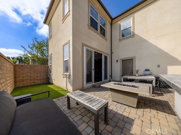 2999 Walking Beam Place Brea, CA 92821 - Photo 19 of 26 a view of a backyard with furniture and a fire pit