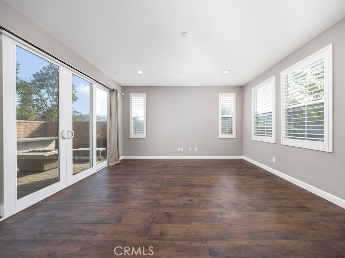 2999 Walking Beam Place Brea, CA 92821 - Photo 4 of 26 a view of an empty room with wooden floor and a window
