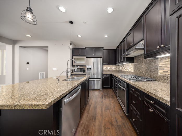 2999 Walking Beam Place Brea, CA 92821 - Photo 6 of 26 a large kitchen with stainless steel appliances granite countertop plenty wooden cabinets counter space a sink and a stove