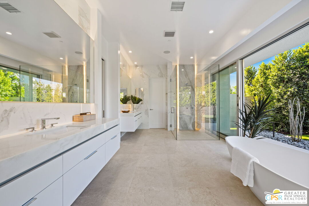 11 Sterling Ridge Drive Rancho Mirage, CA 92270 - Photo 15 of 33 a bathroom with a double vanity sink and a large mirror
