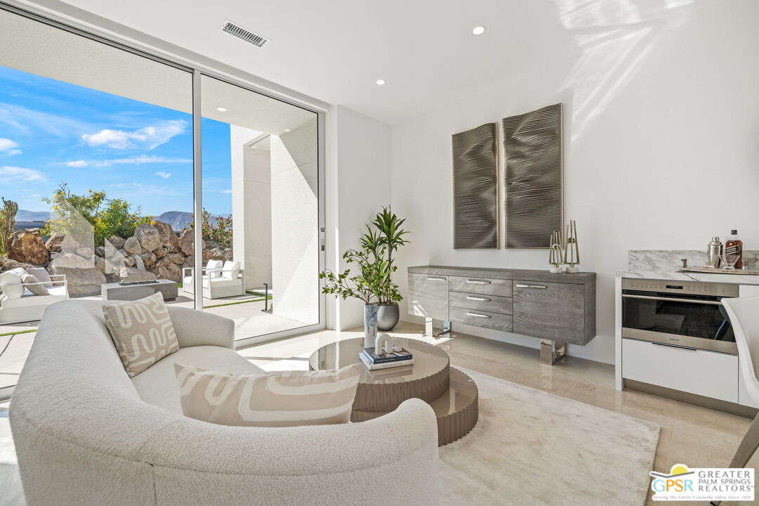 11 Sterling Ridge Drive Rancho Mirage, CA 92270 - Photo 17 of 33 a living room with furniture and a fireplace