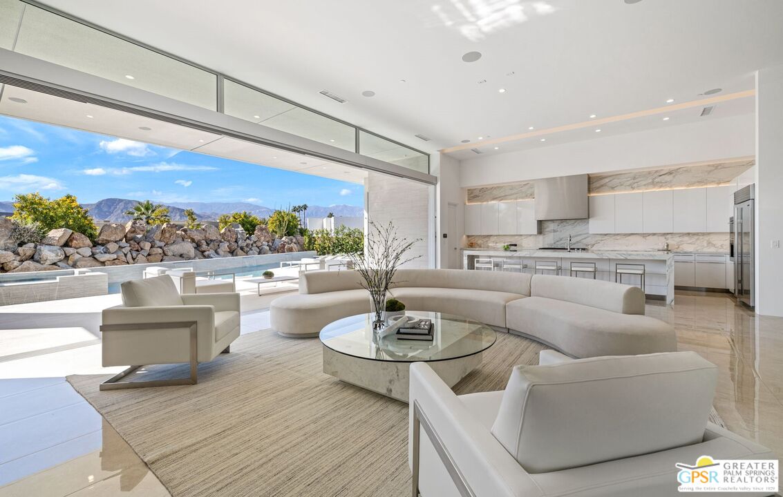 11 Sterling Ridge Drive Rancho Mirage, CA 92270 - Photo 20 of 33 a living room with couches and a table
