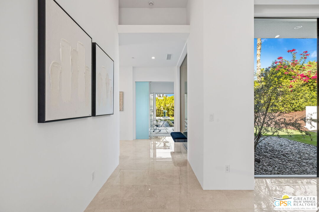 11 Sterling Ridge Drive Rancho Mirage, CA 92270 - Photo 24 of 33 a view of a hallway with wooden floor and a potted plant
