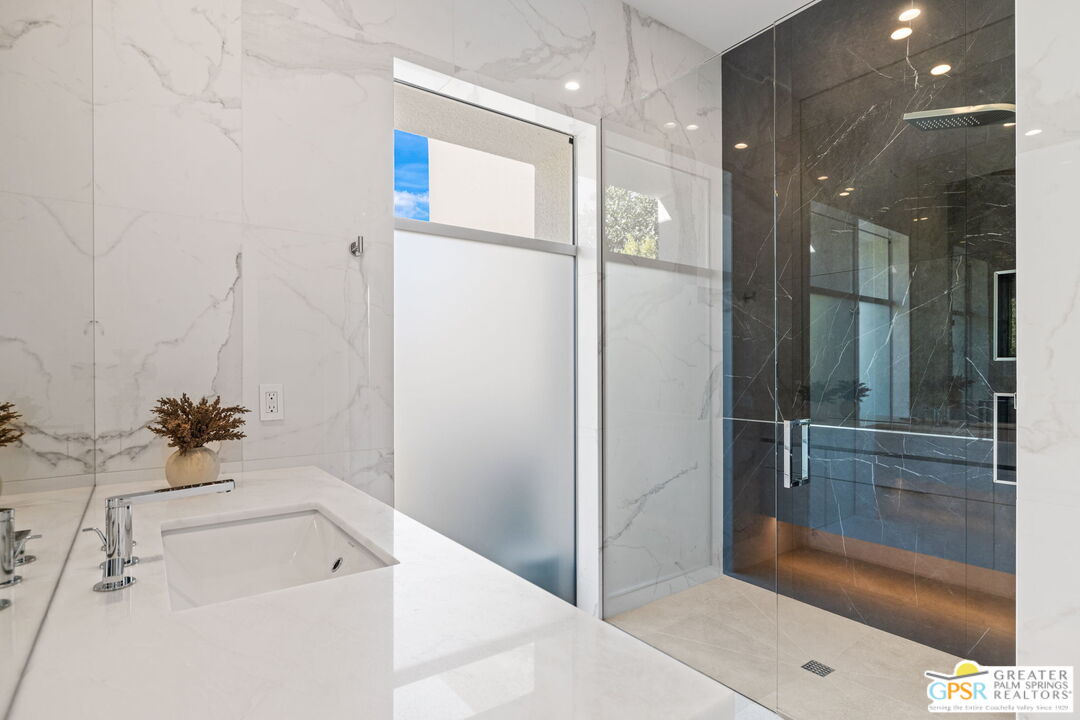 11 Sterling Ridge Drive Rancho Mirage, CA 92270 - Photo 26 of 33 a bathroom with a bathtub and a shower