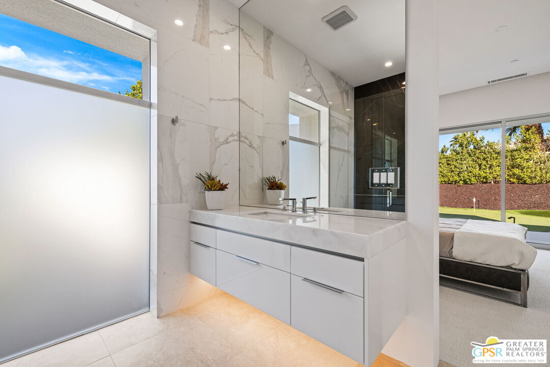 11 Sterling Ridge Drive Rancho Mirage, CA 92270 - Photo 27 of 33 a bathroom with a tub sink and mirror