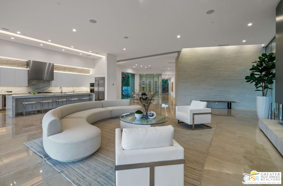 11 Sterling Ridge Drive Rancho Mirage, CA 92270 - Photo 9 of 33 a living room with furniture and a potted plant