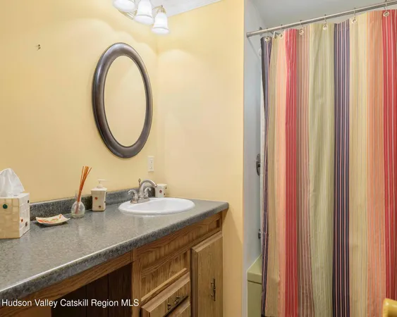 a bed sitting in a bedroom next to a cabinet