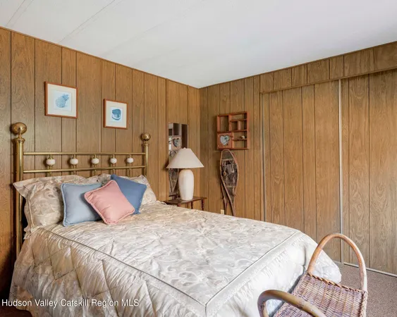 a view of a backyard with table and chairs couches with wooden floor and fence