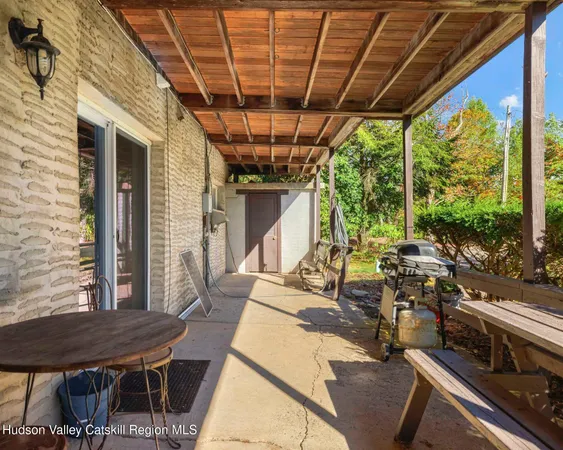 a view of a kitchen with stainless steel appliances