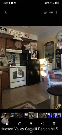 a view of a kitchen with appliances and cabinets
