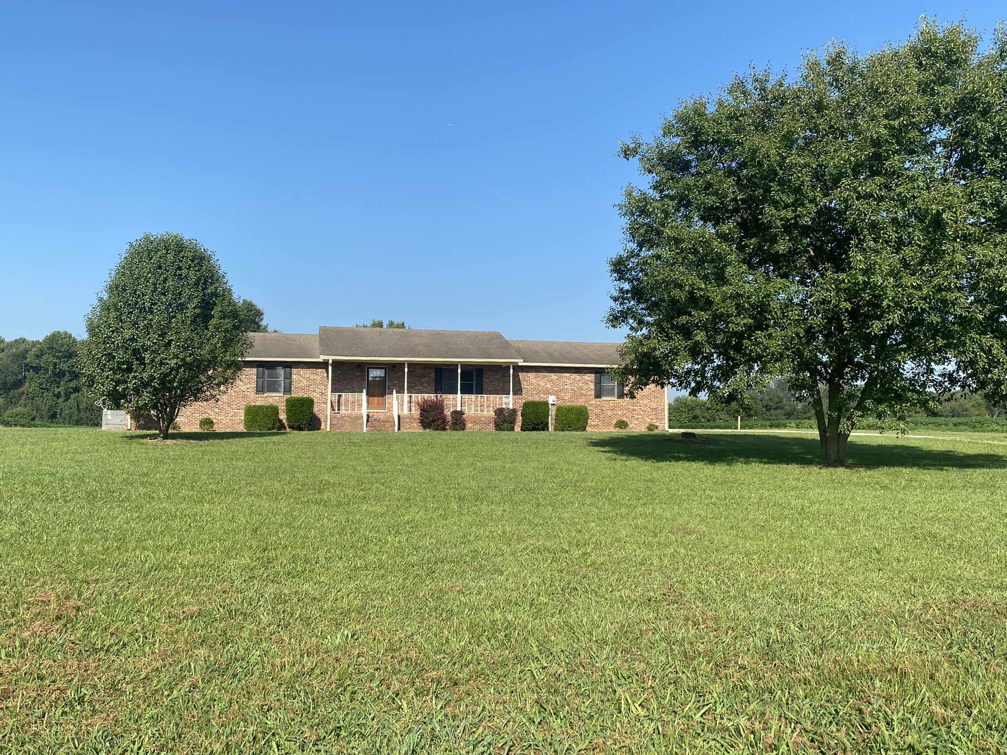 1239 Caney Branch Road Morrison, TN 37357 - Photo 1 of 19 a front view of a house with a garden